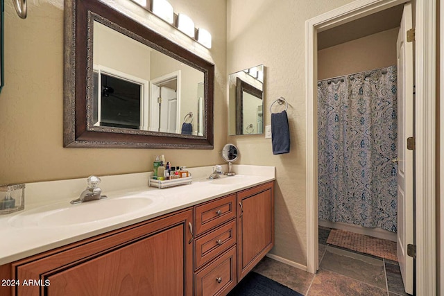 bathroom featuring vanity and a shower with curtain