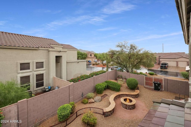 view of yard with a fire pit