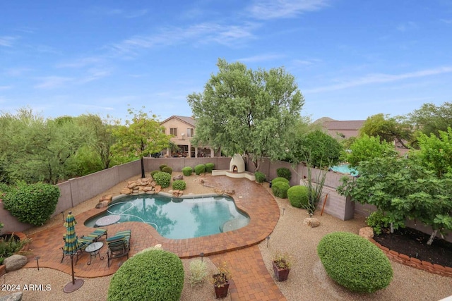 view of swimming pool featuring a patio