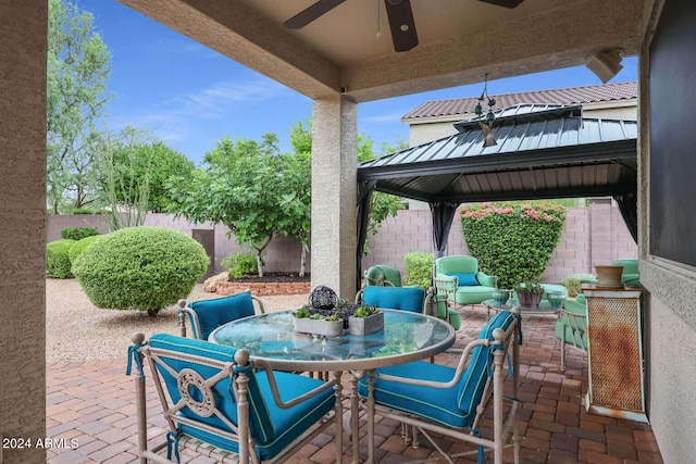 view of patio / terrace with a gazebo, an outdoor hangout area, and ceiling fan