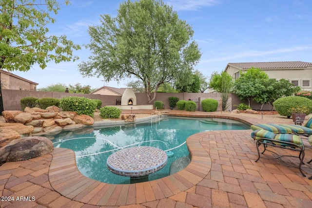 view of swimming pool featuring a patio area