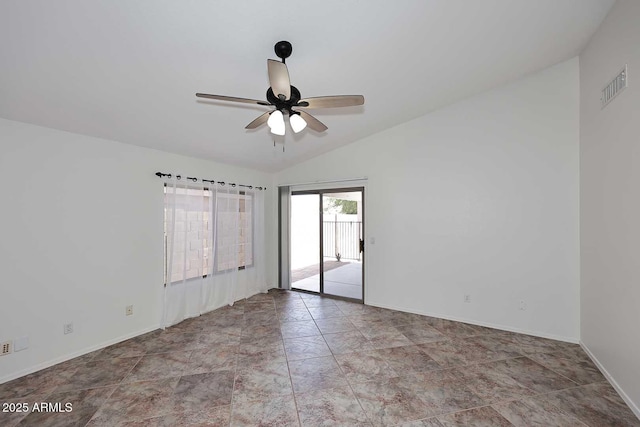 unfurnished room featuring lofted ceiling, a ceiling fan, and baseboards