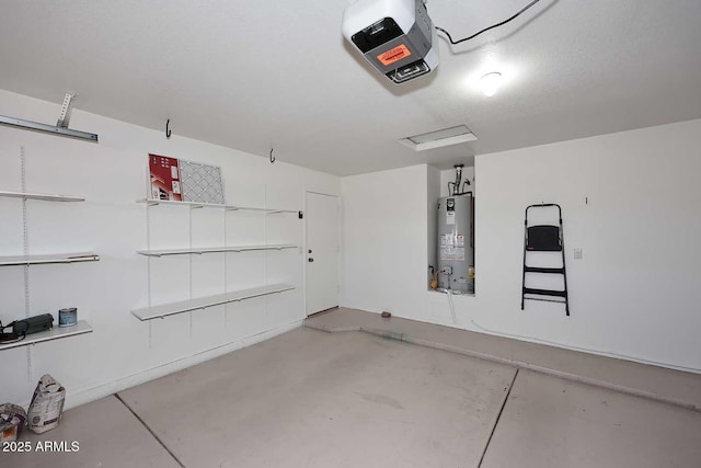 garage featuring gas water heater and a garage door opener