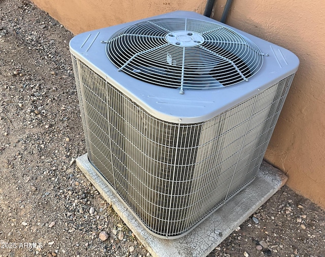 details with stucco siding and central air condition unit