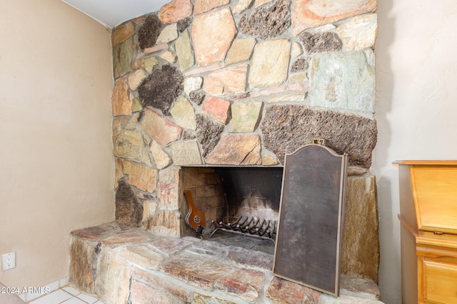 interior details with a stone fireplace