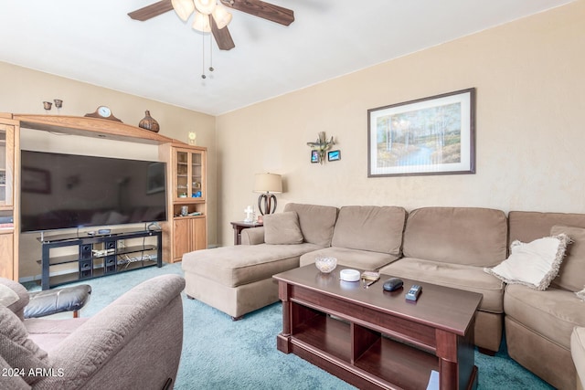 carpeted living room with ceiling fan