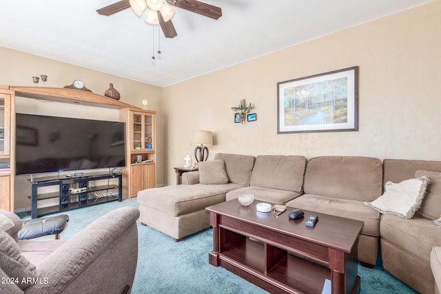 living room featuring ceiling fan and carpet flooring