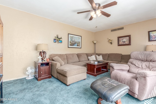 carpeted living room with ceiling fan