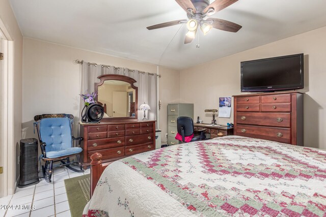 bedroom with ceiling fan and light tile patterned floors