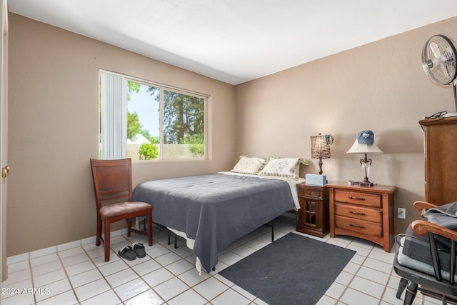 bedroom featuring light tile patterned floors