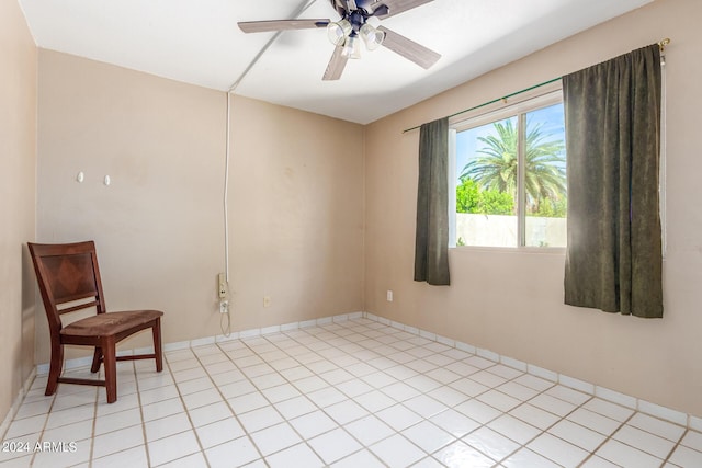 unfurnished room with light tile patterned flooring and ceiling fan