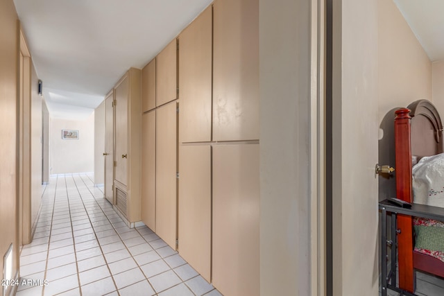 corridor featuring light tile patterned floors