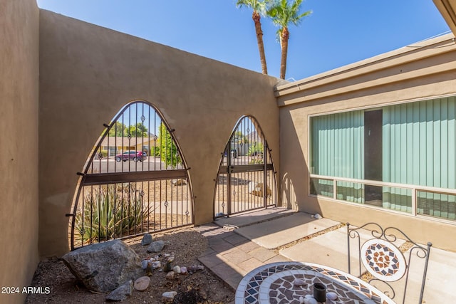 view of patio / terrace with a gate