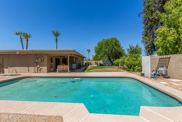 view of pool featuring a fenced in pool, fence, and a patio