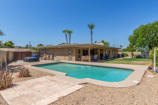 view of pool with central AC and a patio area