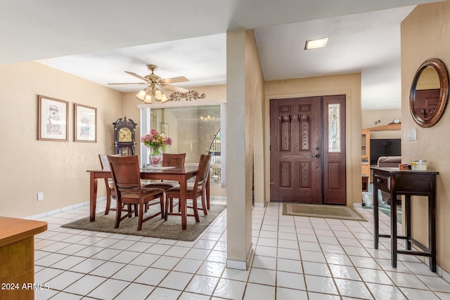 entryway featuring light tile patterned floors and a ceiling fan