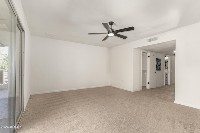 spare room featuring carpet flooring and ceiling fan