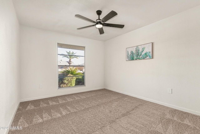 empty room featuring carpet flooring and ceiling fan