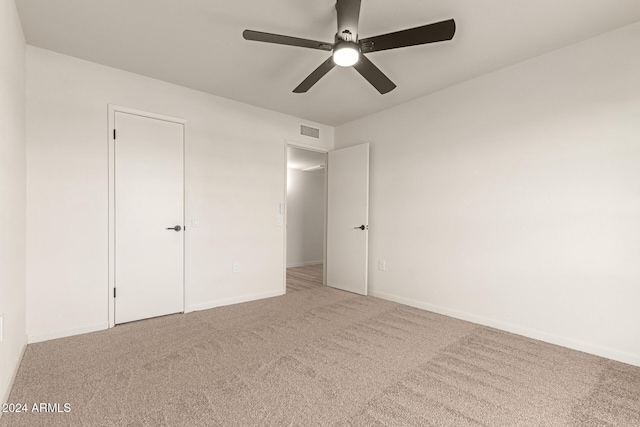 unfurnished bedroom with carpet flooring and ceiling fan