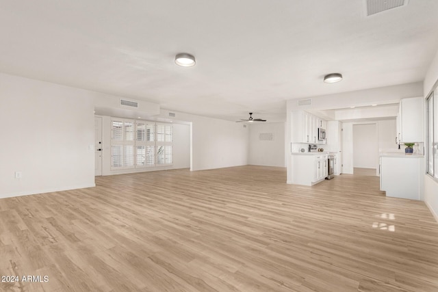 unfurnished living room with light wood-type flooring and ceiling fan