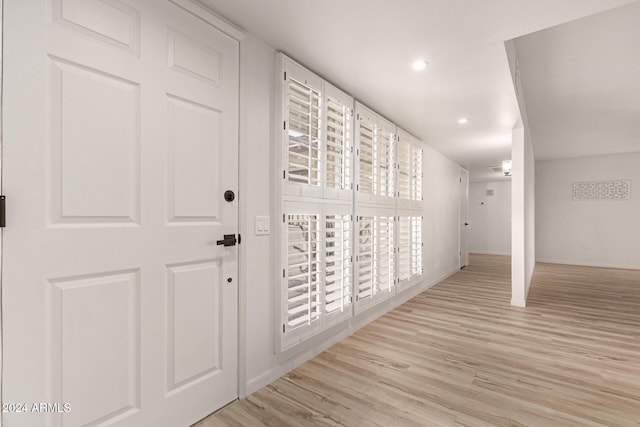 corridor featuring light hardwood / wood-style flooring