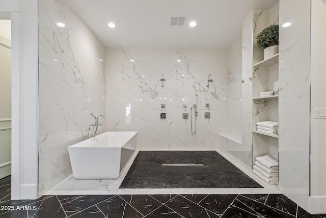 2625 N 24th St Unit 15, Mesa, AZ 85213 - bathroom with marble tiled flooring, stone wall, a freestanding tub, recessed lighting, and a marble finish shower