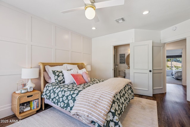 2625 N 24th St Unit 15, Mesa, AZ 85213 - bedroom featuring a decorative wall, dark wood-style flooring, recessed lighting, a ceiling fan, and connected bathroom