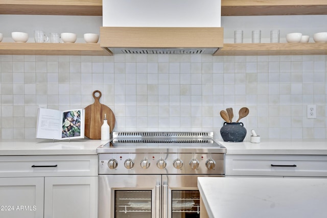 kitchen featuring open shelves, premium range hood, range with two ovens, and light countertops