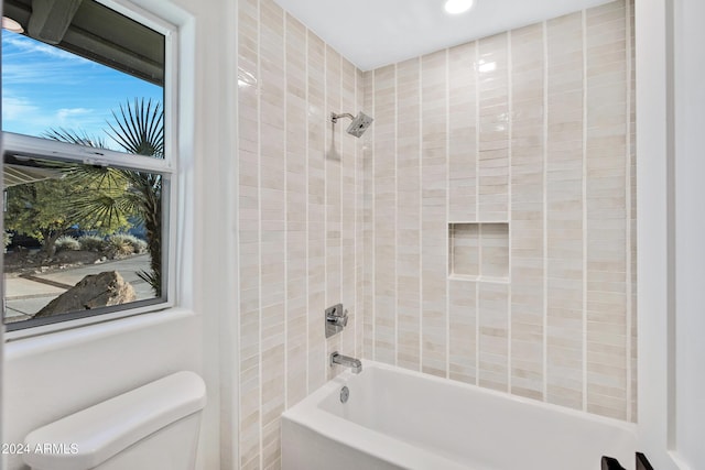 bathroom featuring toilet and  shower combination