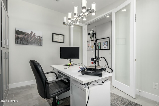 home office with light tile patterned floors and baseboards