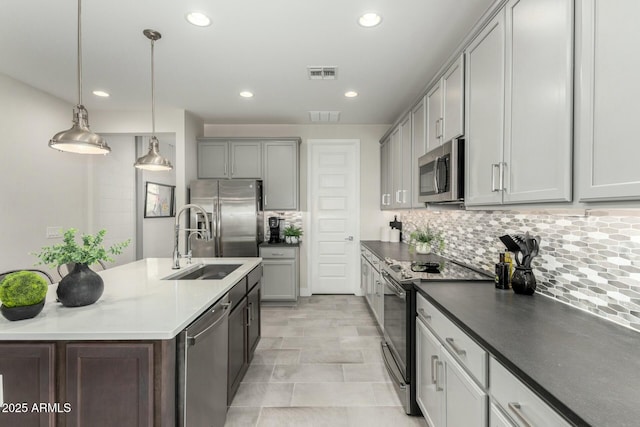 kitchen with recessed lighting, stainless steel appliances, and visible vents