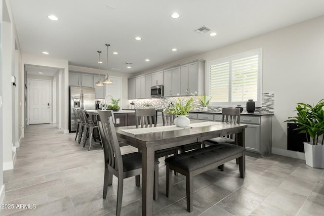 dining area featuring visible vents, recessed lighting, and baseboards