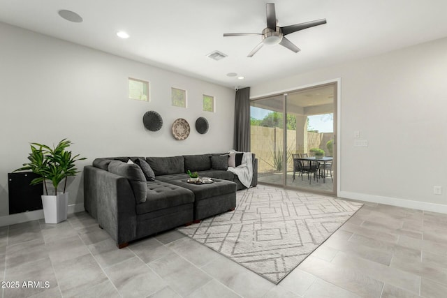 living area with recessed lighting, visible vents, ceiling fan, and baseboards