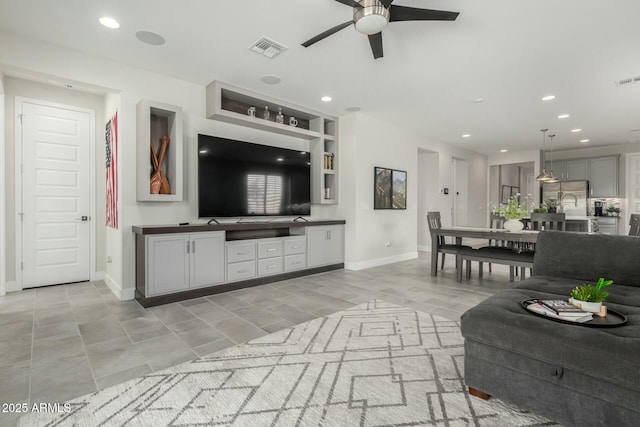 living room with visible vents, recessed lighting, and baseboards