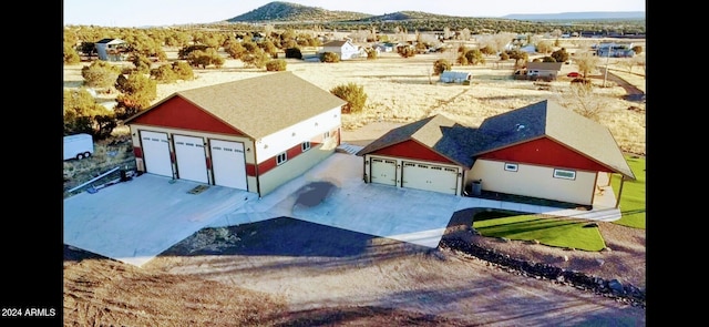 birds eye view of property featuring a mountain view