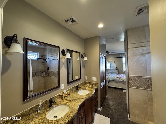 bathroom featuring vanity and ceiling fan