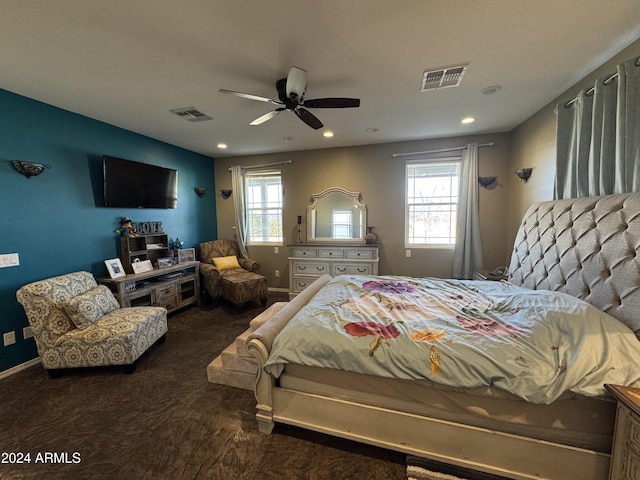 bedroom with ceiling fan and dark hardwood / wood-style flooring