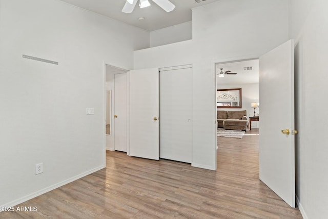 unfurnished bedroom featuring ceiling fan and light hardwood / wood-style floors