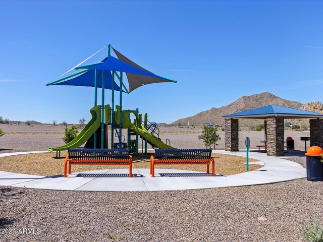 communal playground featuring a mountain view