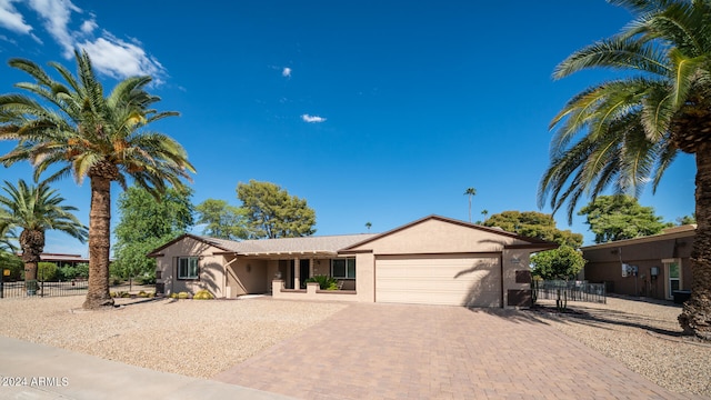 single story home featuring a garage