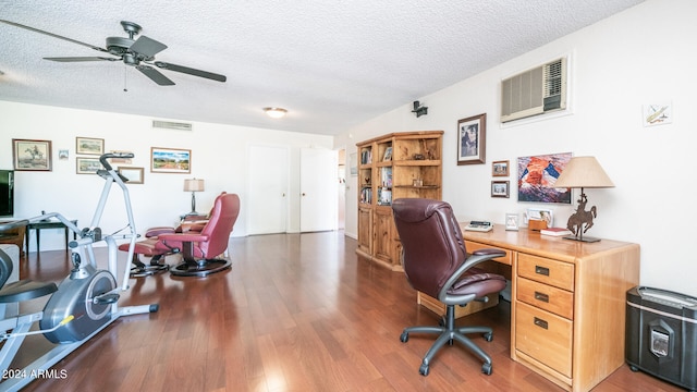 home office featuring ceiling fan, a textured ceiling, a wall mounted air conditioner, and dark hardwood / wood-style flooring