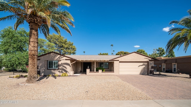 single story home with a garage