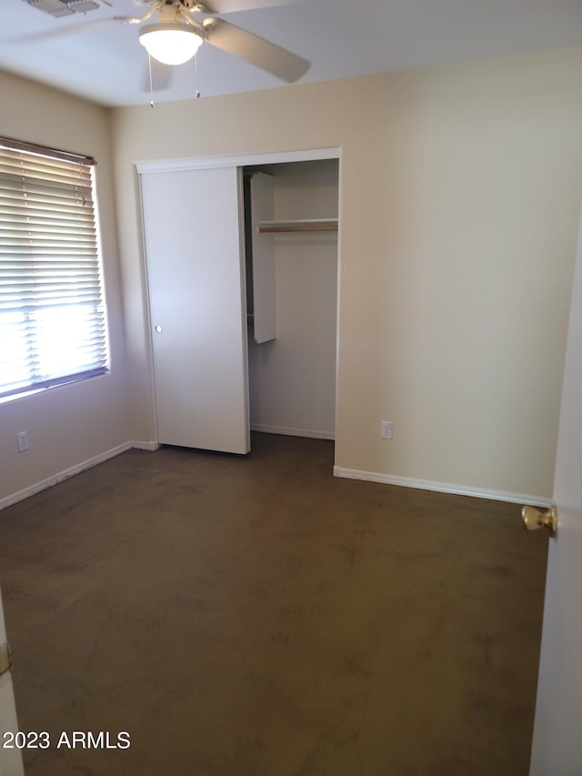 unfurnished bedroom with a ceiling fan, a closet, visible vents, and baseboards