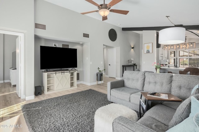 living room with light wood-type flooring and ceiling fan