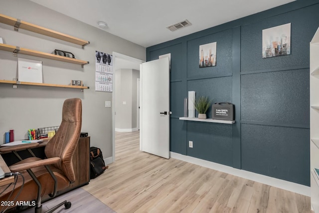 office area with light hardwood / wood-style floors