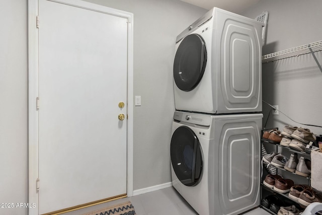 laundry room featuring stacked washer / dryer