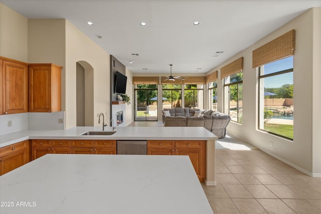 3410 E Inglewood Cir, Mesa, AZ 85213 - kitchen featuring stainless steel dishwasher, open floor plan, ceiling fan, light countertops, and a sink