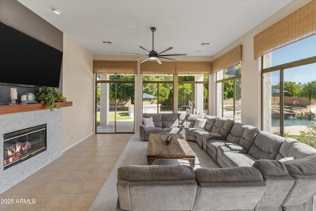 3410 E Inglewood Cir, Mesa, AZ 85213 - living room with ceiling fan, visible vents, light tile patterned floors, and a fireplace