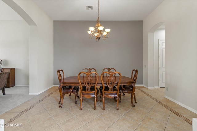 3410 E Inglewood Cir, Mesa, AZ 85213 - dining room with visible vents, arched walkways, and light tile patterned floors
