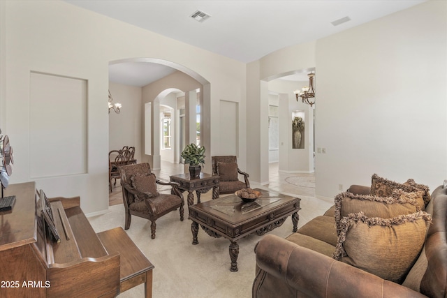 3410 E Inglewood Cir, Mesa, AZ 85213 - living room featuring baseboards, arched walkways, a chandelier, and visible vents